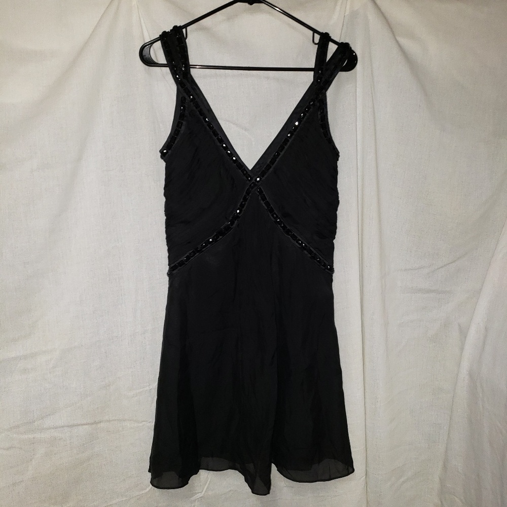 Black cocktail dress with gem trim